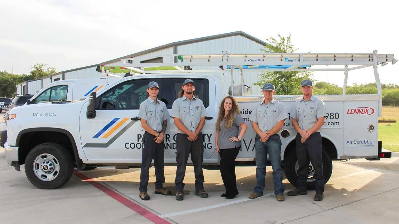 Parker County team in front of one of their trucks